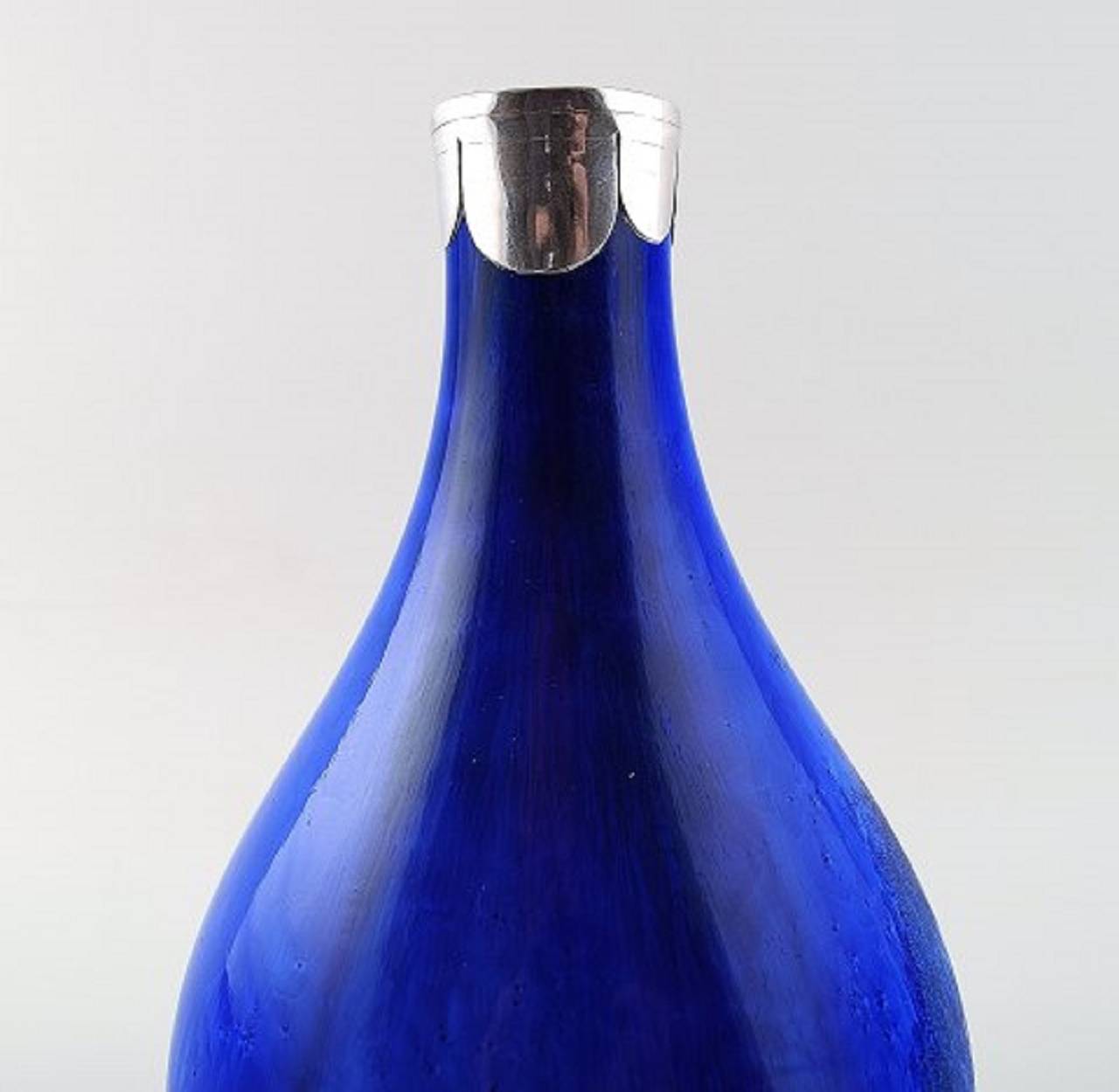 Unique Soren Berg for Royal Copenhagen, crystal glaze vase with silver mounts.
Very beautiful glaze in shades of blue.
Signed SB. 1920s.
Measure: Height 19cm
In perfect condition. 1st. factory quality.