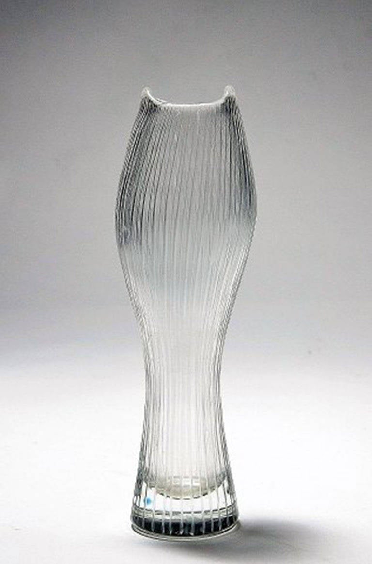 Tapio Wirkkala for Iittala. 
Clear art glass with engraved decoration in form of stripes. 
Signed Tapio Wirkkala Iittala. 
Measures: Heights 16.5 cm. 
In perfect condition.
Provenance: The collectors Daisy and Torsten Ingelsson.