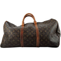 Louis Vuitton "Keep All 55" travel bag in canvas and leather.