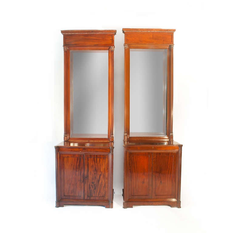 Mahogany wall cabinets with large 162cm high mirrors, and base cabinets with storage.
