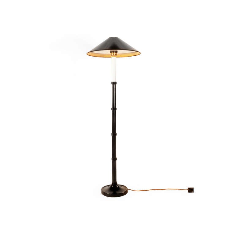 A classic black turned beech wood, oriental style table lamp with ring detail designed by Anouska Hempel. Includes black and gold shade and diffuser.

Size
920mm from floor to top of shade 
160 mm base

Finishes
Base also available in ivory,