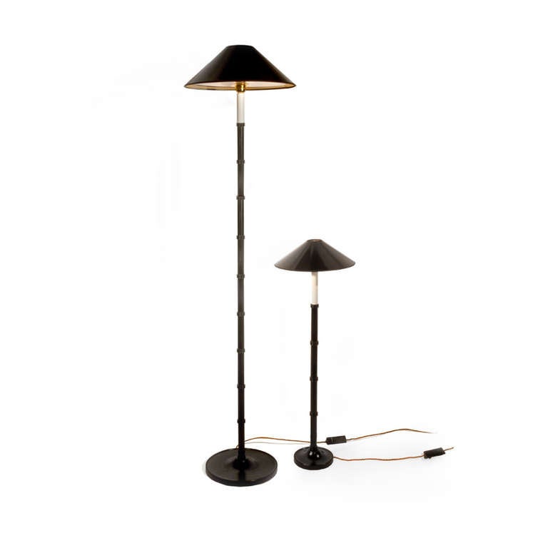 A classic black turned beech wood, oriental style table lamp with ring detail designed by Anouska Hempel. Includes black and gold shade and diffuser.

Size
1600mm from floor to top of shade 
300 mm base

Finishes
Base also available in ivory,