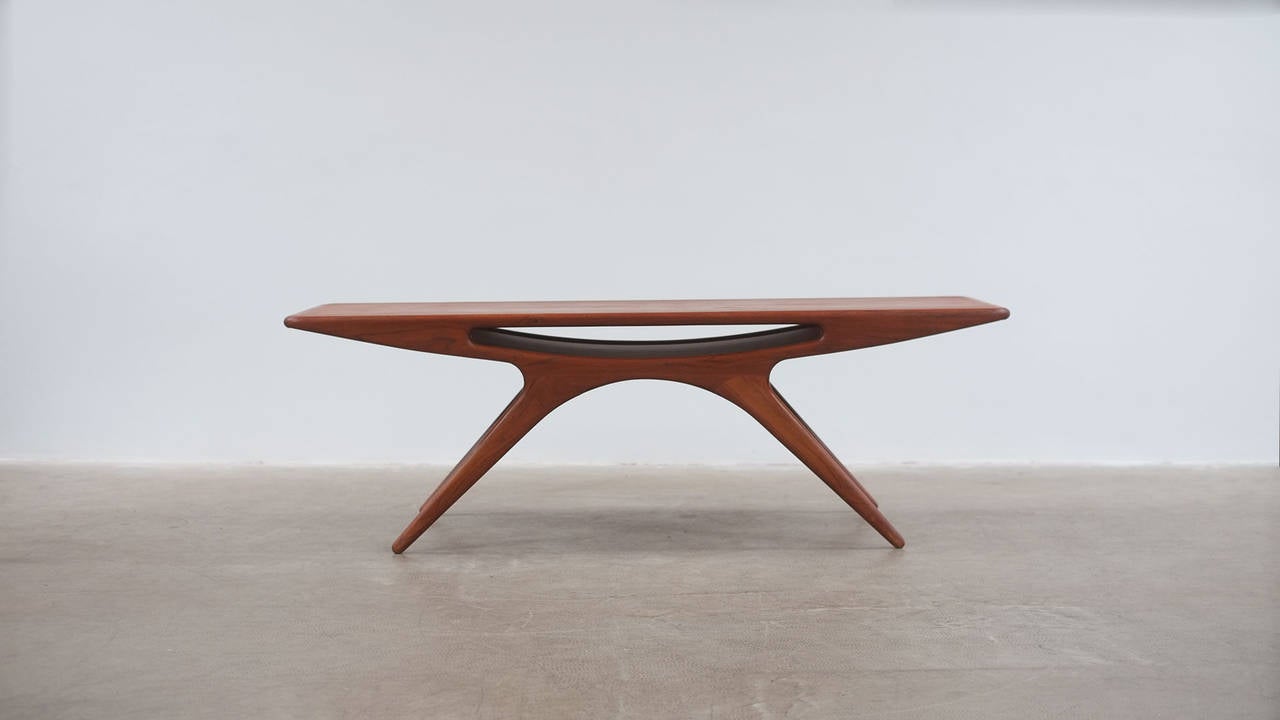 Beautiful and sought after Smile or ‘UFO’ coffee table in teak by Johannes Andersen for CFC Silkeborg, Denmark. Amazing example with beautiful patina.