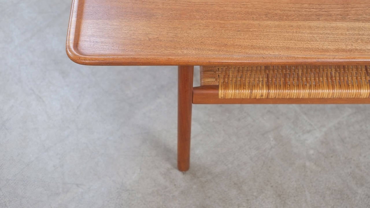 Beautiful model AT10 coffee table in solid teak and rattan designed by Hans Wegner for Andreas Tuck, Denmark.