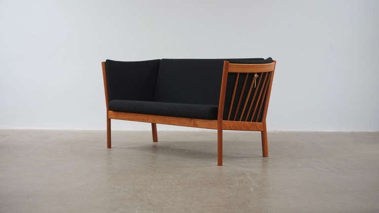 Beautiful Pin Sofa in cherry by Erik Jorgensen, Denmark. Very elegant small sofa or loveseat in fantastic condition. One available.