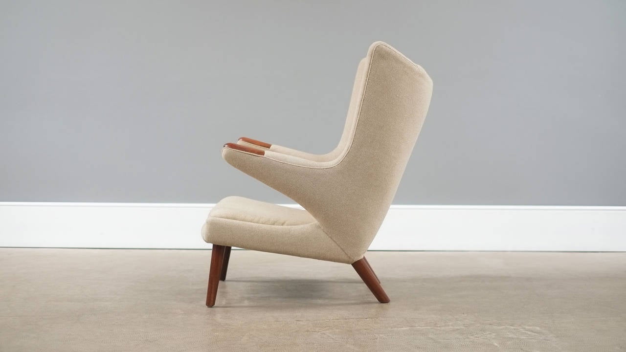 Wonderful original Papa Bear chair designed by Hans Wegner for AP Stolen, Denmark. Very beautiful example with original fabric and teak legs and ‘paws’. Please contact for new upholstery options.