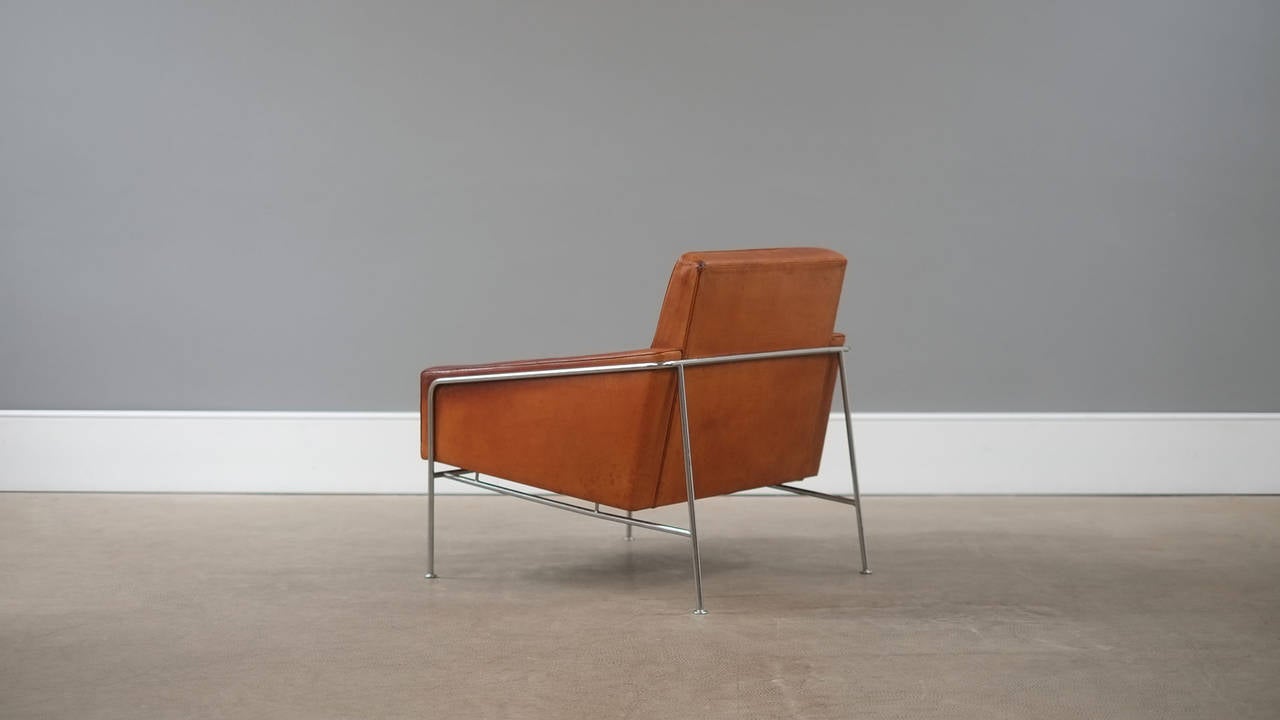 Ultra rare first production 3300 chair designed by Arne Jacobsen for Fritz Hansen, Denmark 1956. This amazing example in original cognac leather with exceptional patina. Incredible chair.