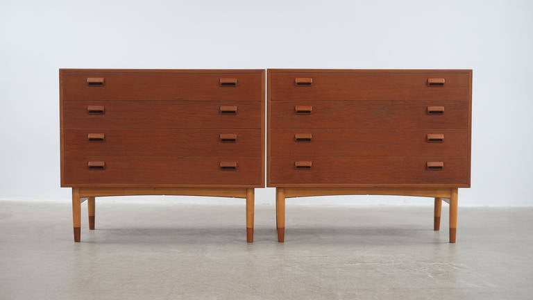 Wonderful original pair of dressers or chests in teak with contrasting beech legs and teak shoes designed by Borge Mogensen for Soborg Mobler, Denmark. Superb condition.