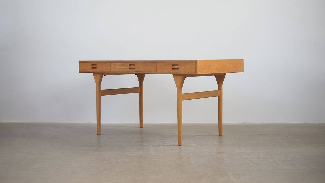 Famous and super desirable desk designed by Nanna Ditzel for Soren Willadsen, Denmark. This example in rare oak finish. Beautiful piece.