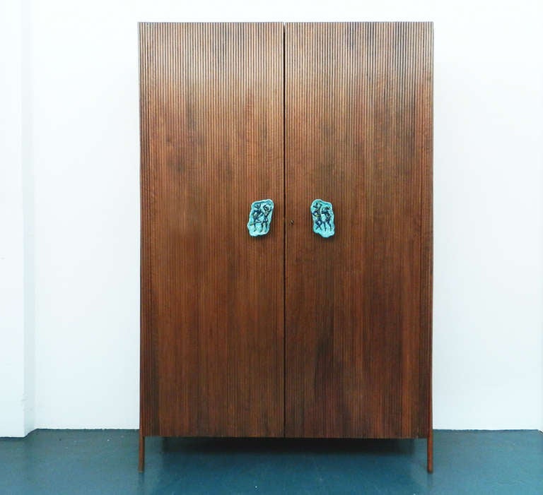 Beautiful wardrobe attributed to Osvaldo Borsani for Atelier Borsani.
Colored ceramic handles are hand-made by Roberto Quattrini.