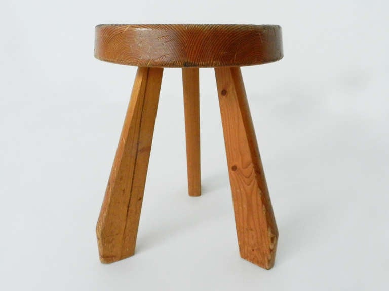 Another version of the milking stool, taller than the Tabouret Berger, it was created for a chalet in Méribel, France and inspired by local interior architecture. The legs are cut and geometric. 
In the 1960's Perriand was involved in different
