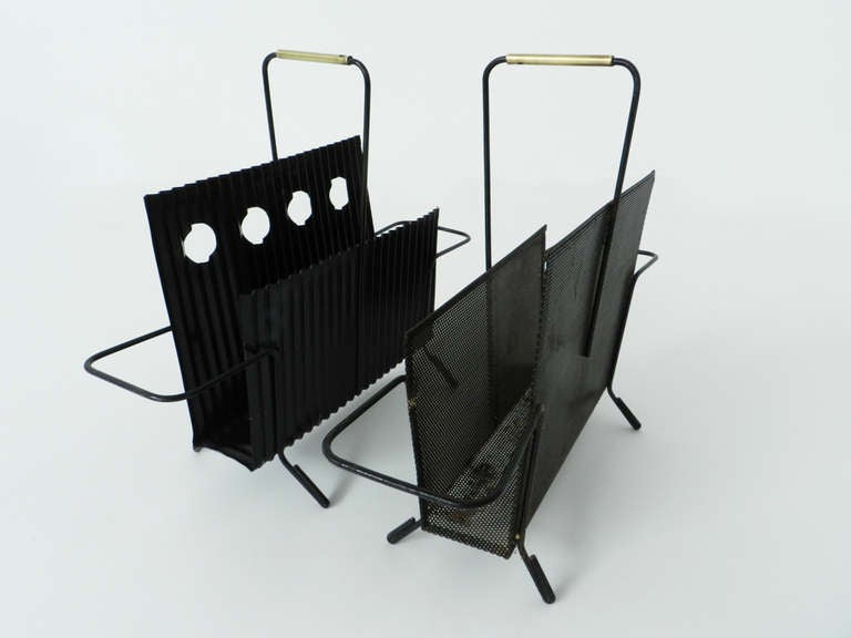 2 Java magazine holders by the the french master Mathieu Matégot.
The tinplates are black painted with some brass details that give value to the minimal design.

Referenced in the Philippe Jousse book about Mathieu Mategot edited by Jousse.