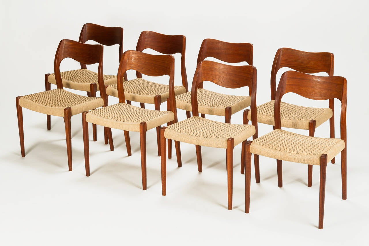 Wonderful set of eight dining chairs, model no 71, designed by Niels Moeller for J.L. Moeller in the 1960s. Beautiful organic form, the frame is made of teakwood, the seats are made of paper cord. The paper cord was partly restored. J. L. Moeller