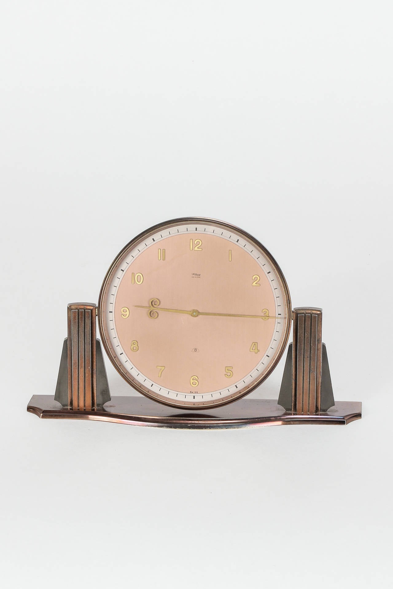Swiss Art Deco table clock in copper by Arthur Imhof in the 1930's. The Imhof manufacture was established in 1924 and since then stands for quality, precision  and tradition. Every watch is a unique item, manufactured with passion for details. This