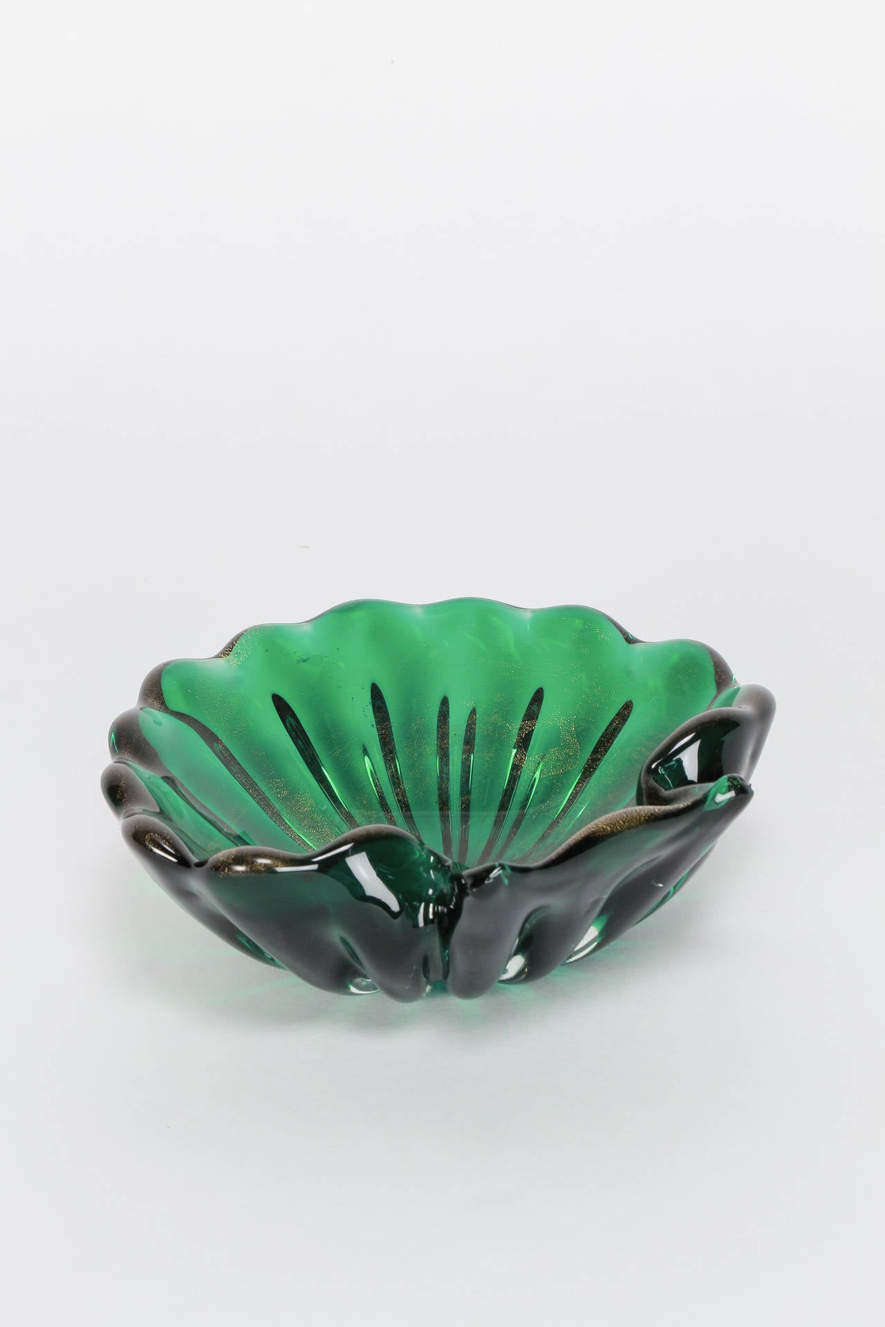 Beautiful green glass bowl in the style of Barovier & Toso with gold leaf inclusions. the inclusions are only on the inside of the bowl and are better seen in the last photo!