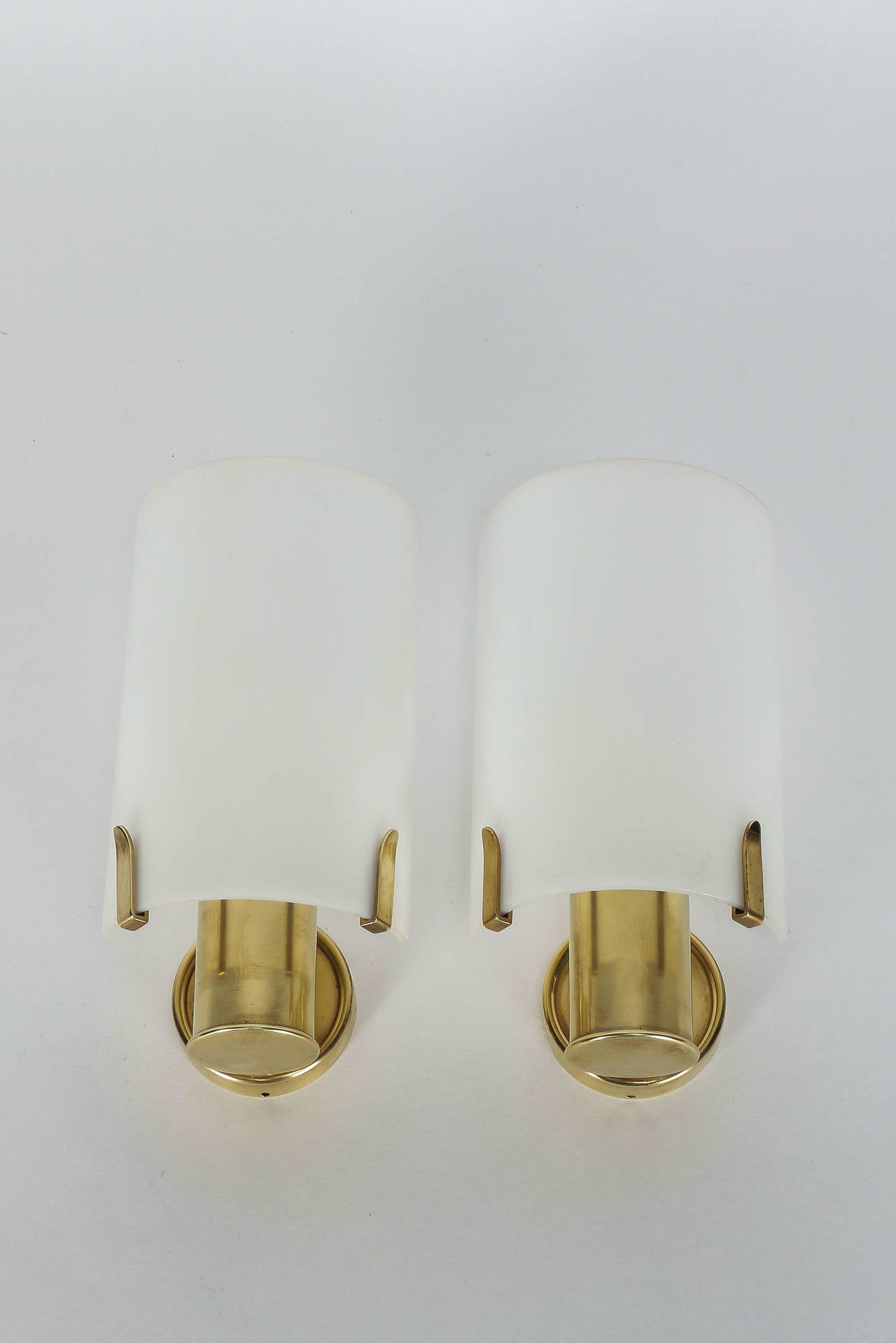 Pair of swiss brass wall lamps from the 1960's. Lovely details, very warm light