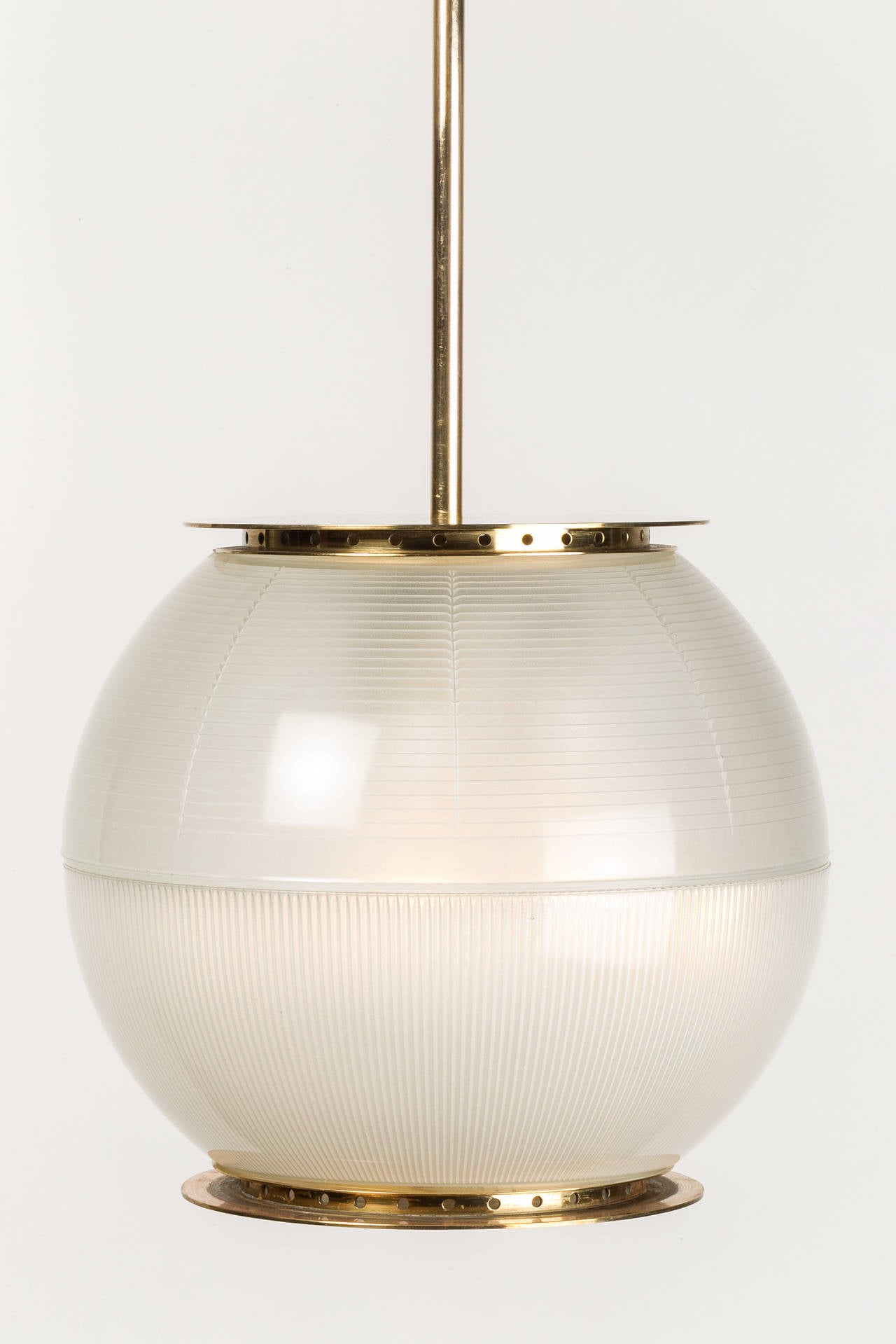 Incredibly rare Ignazio Gardella pendant, model LP 8 designed in 1956 and manufactured in the same year by Azucena in Italy. The two pressed glass hemispheres are framed in solid brass. This lamp stands for revolutionary modernity and timeless