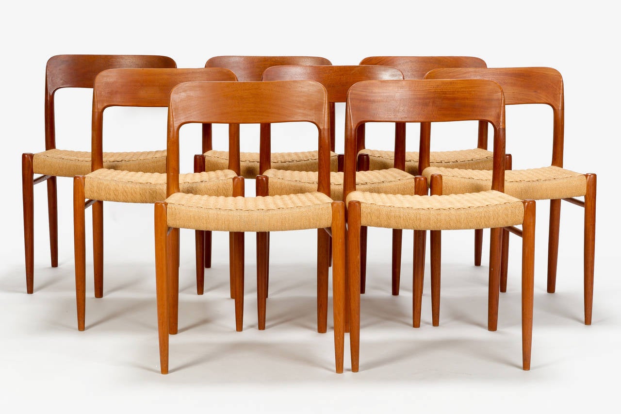 Wonderful set of 8 danish dining chairs, model no 75 by Niels Moeller for J.L. Møller in Denmark. These chairs were designed in 1954 it was the second design of the master. The round organic backrest and the simple form gives this chair its timeless