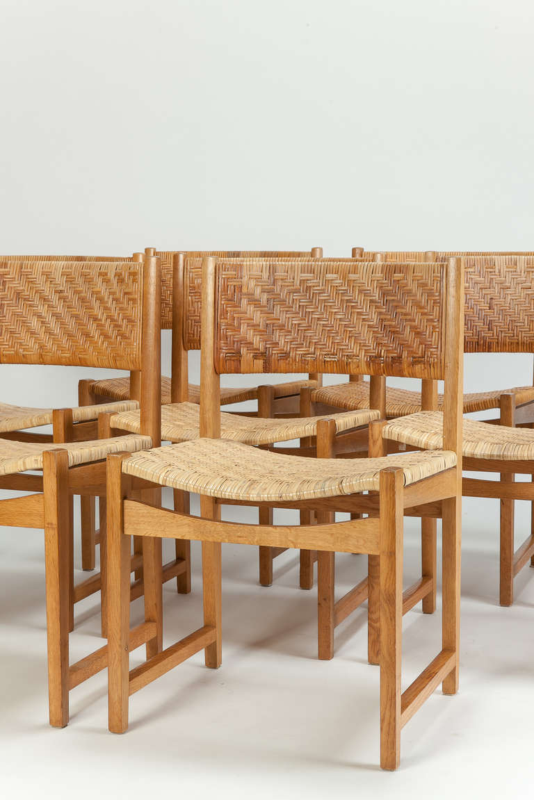 Set of 6 oak chairs model no. 350 by Peter Hvidt & Orla Mølgaard-Nielsen for Søborg Møbelfabrik, Denmark, 1960's. Solid oak frame and woven cane seat and backrest. The photo displays 8, but there are only 6 left.