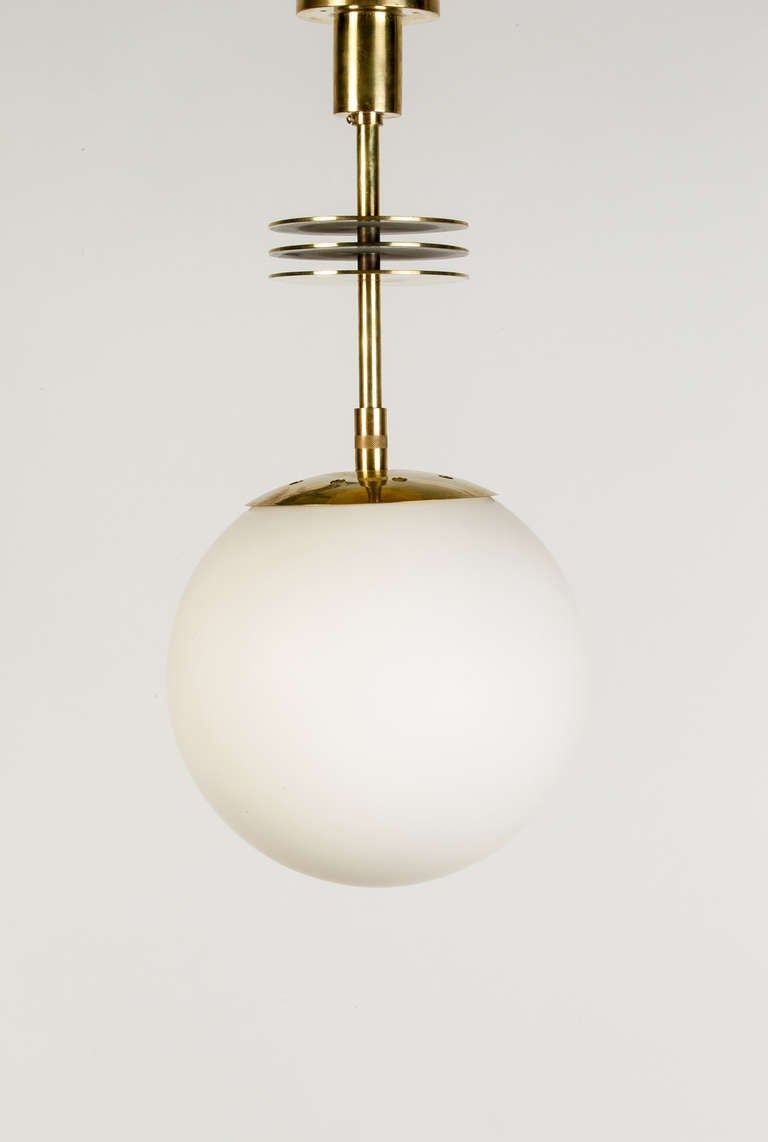 Very rare solid brass ceiling lamp by BAG Turgi, Switzerland, from the 1930s. The three panes of brass on the lamp neck make this piece a one of a kind.