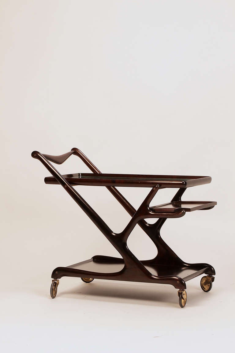 Elegant mahogany bar cart designed by Cesare Lacca for Cassina, Italy, 1950s. This high quality piece, with its organic shape, beautifies every home.