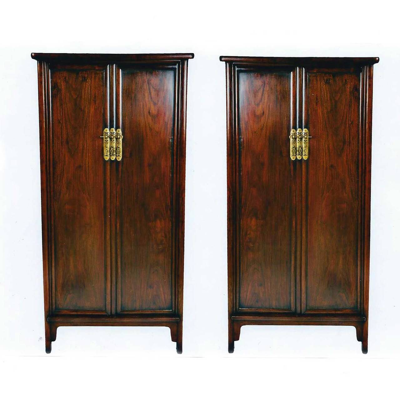 A rare Pair of Early 19th. Century Chinese Rosewood Cabinets, 
The rounded corners are typical of the Ming Dynasty design from which these are derived. The linear design from the slight tapering presents a visual aspect that is both graceful and