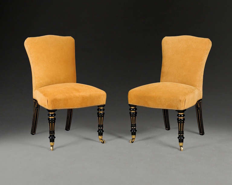 Pair of Black and Gilt Chairs