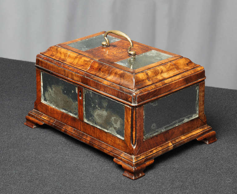 An early 18th century figured walnut and mirrored panel tea caddy complete with the original makers label for Antony Berrisford of Bakewell, Derbyshire.

The label reads:
“Antony Berrisford
Statuary Graver and Carver
Bakewell in Derbyshire
Has