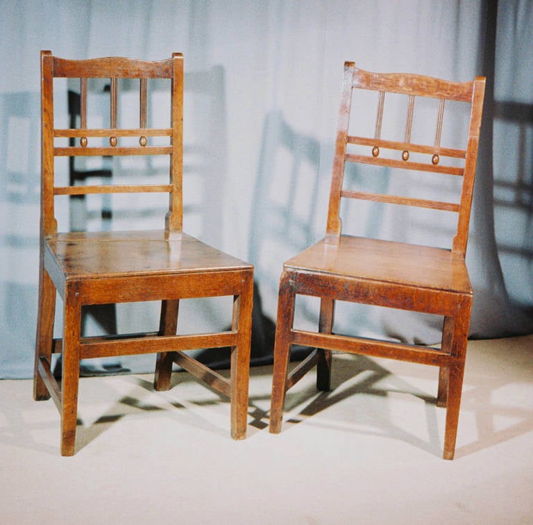A pretty pair of early 19th. century bar-back Dining Chairs in Oak and Ash.