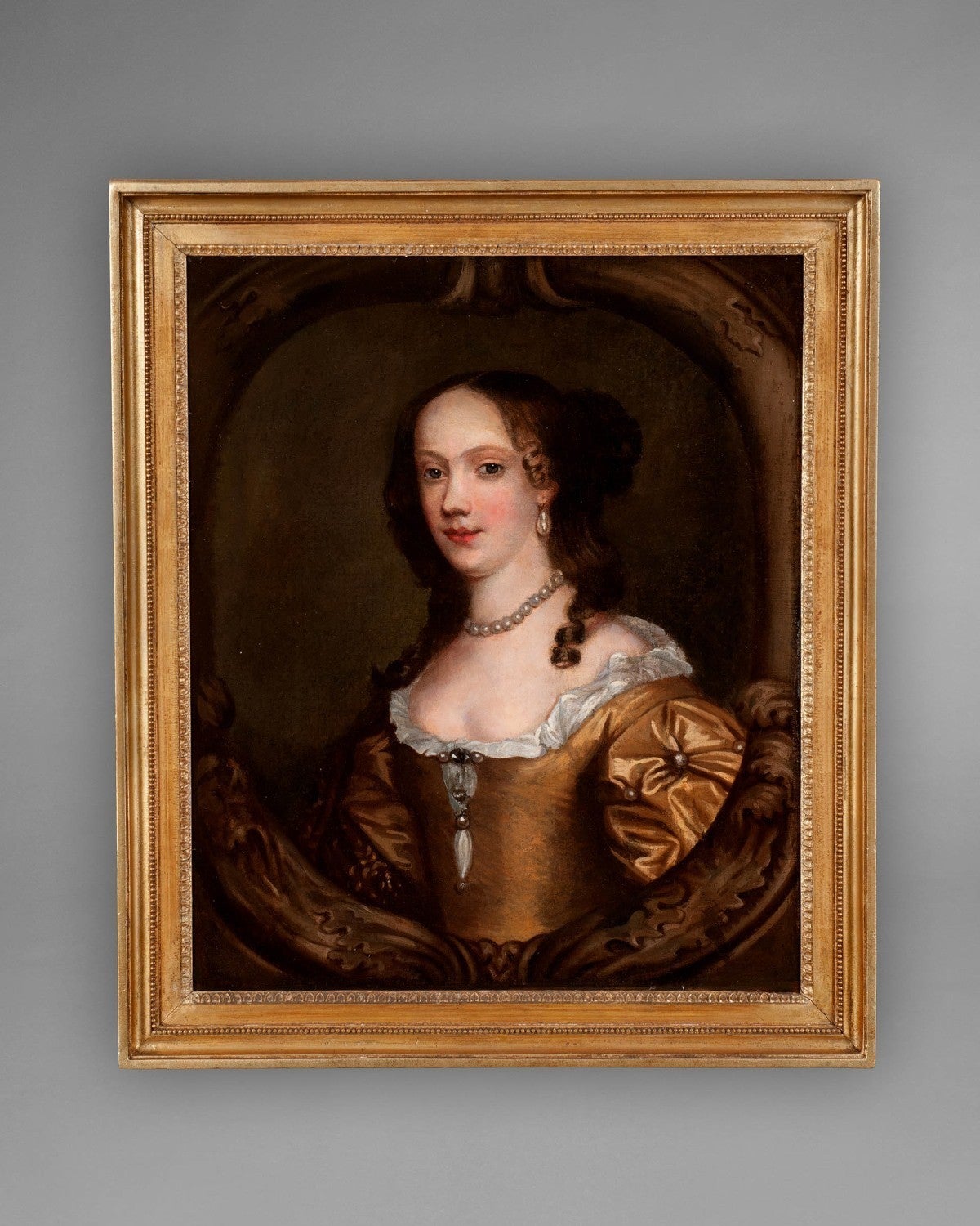 A very good late 17th-early 18th century oil on canvas portrait of a lady, inscribed verso “Lady Blake” in a giltwood frame. The style and composition of this portrait is strikingly similar to many of those painted by Sir Peter Lely, the Court