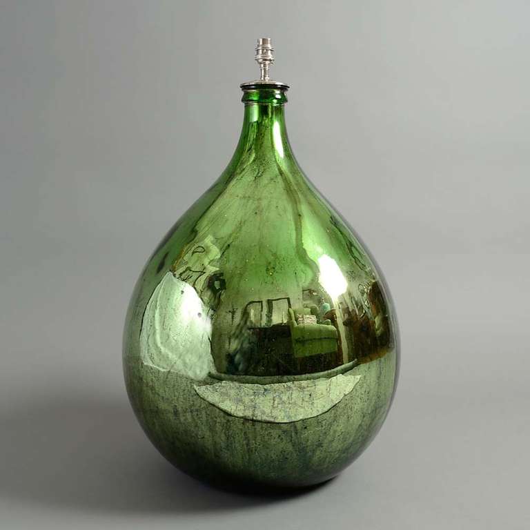 Made from a old, hand blown wine jar.