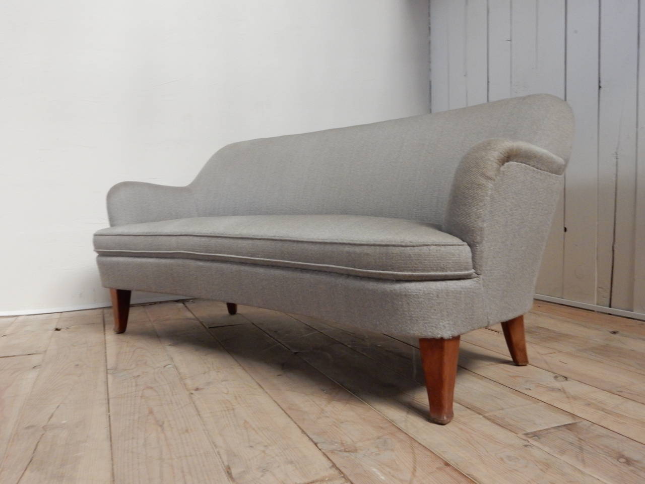 A typical 1950s form libre sofa with perfect structure, garniture (upholstery, circa 1990) blue grey wool.