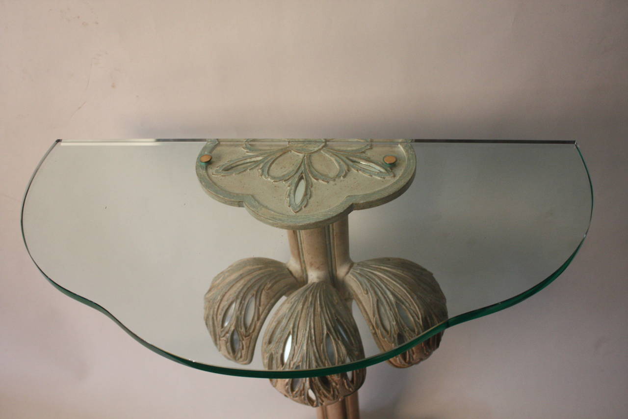 A pair of small console tables in carved wood with mirror insets, in shape of a palm tree, with thick shaped glass top 1950s Italian.
