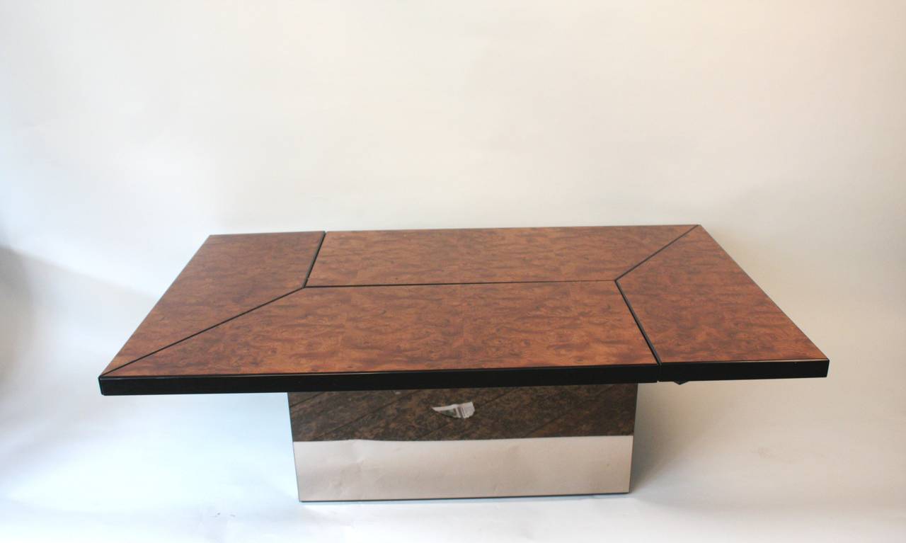 1970s cocktail coffee table designed and manufactured by Paul Michel, France. Adjustable lacquered burr walnut top. Internal storage with glass shelve and mirror detail. Pink mirror plinth.