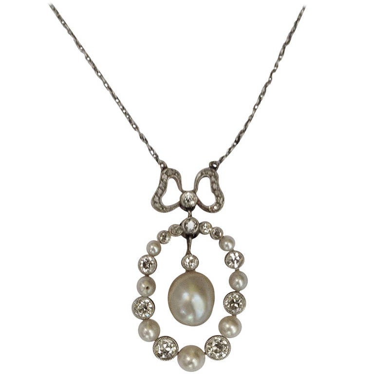 Edwardian Delicate Diamond And Natural Pearl Pendant Necklace With Bow For Sale