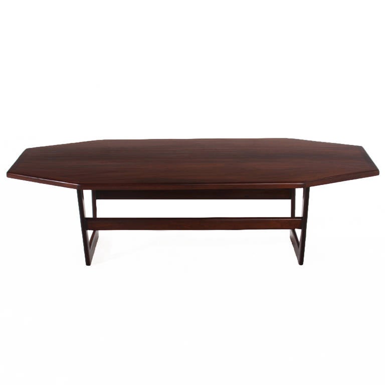 A geometric coffee table in solid Mahogany that is essentially a rectangle with the four corners cut off.

Many pieces are stored in our warehouse, so please click on CONTACT DEALER under our logo below to find out if the pieces you are interested