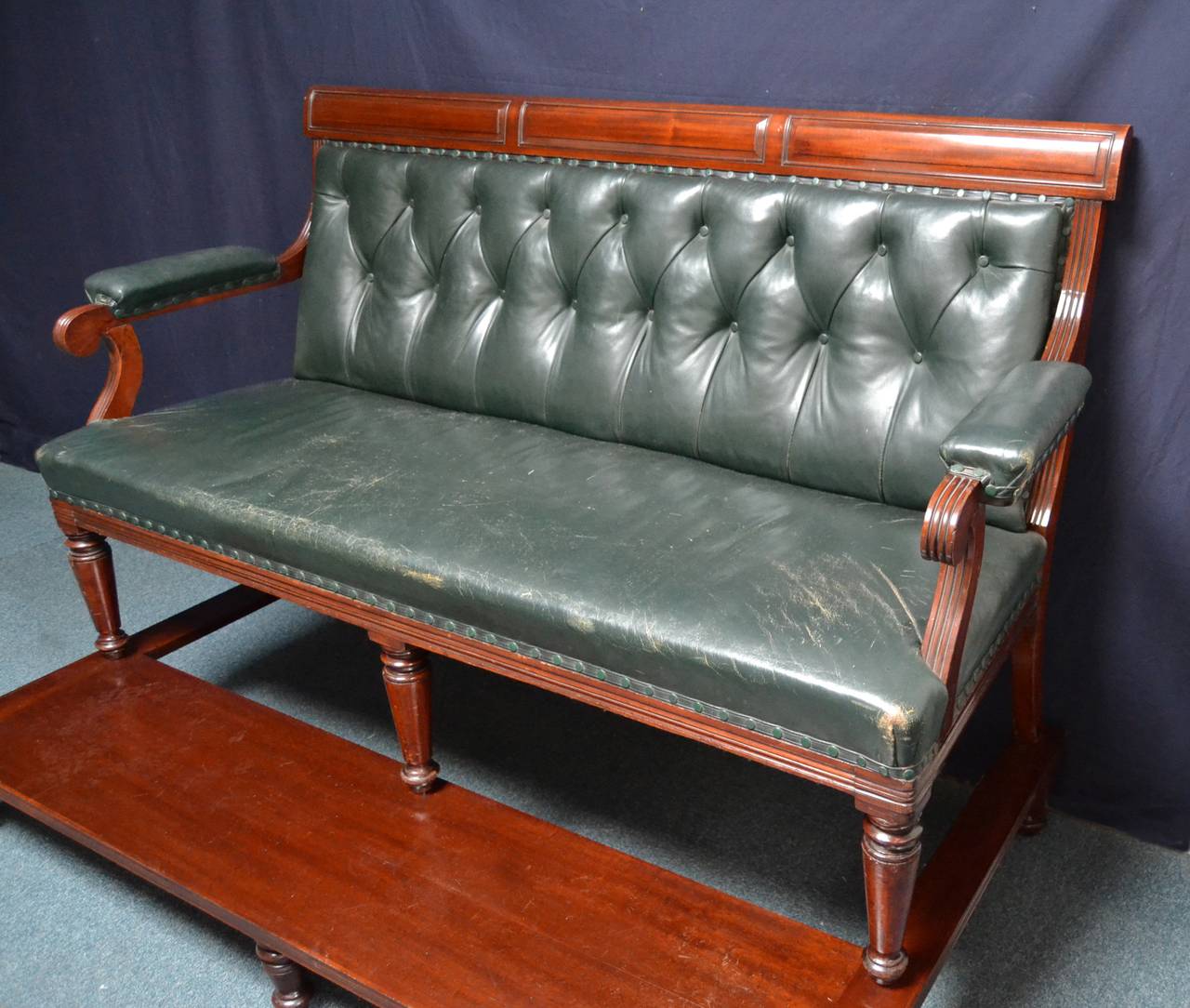 A Mahogany framed Billiard - Snooker viewing bench circa 1900, nicely aged green leather, standing on a raised platform with turned feet, which enables seated spectators an excellent view of the table.

The viewing platform has undergone