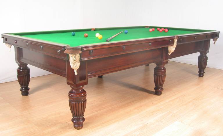 A mahogany 10ft x 5ft three quarter sized Billiard Snooker or Pool table by George Wright of London, circa 1890, this table stands on six elegant turned and reeded legs made of really good dense grained mahogany with applied bosses to the cushion