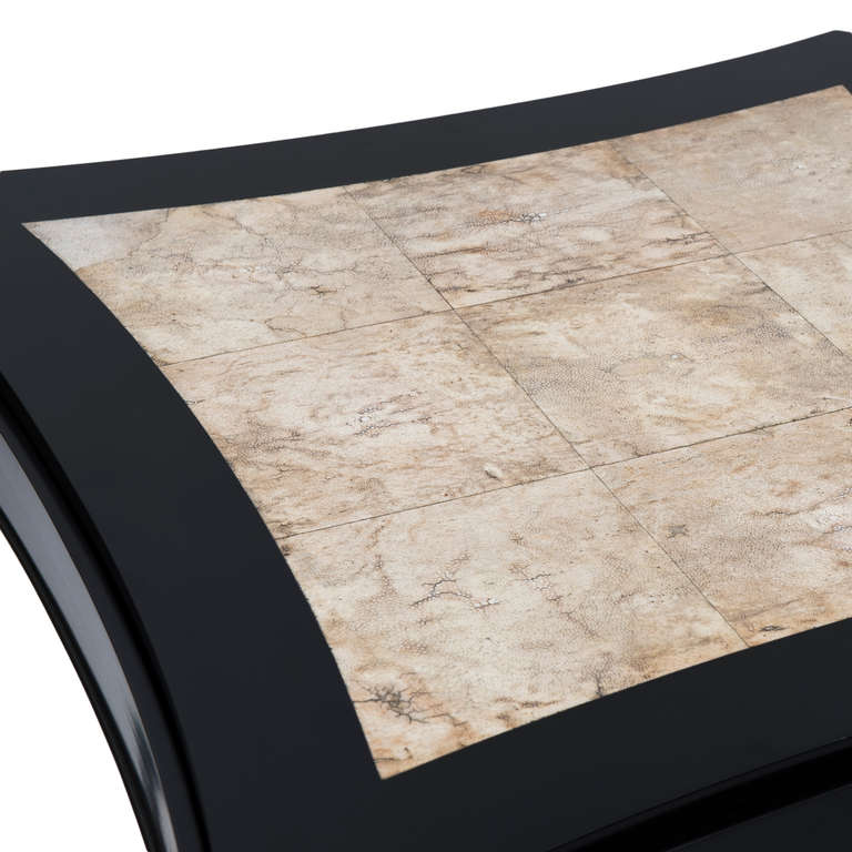 Game table in black varnished wood; the reversible top is adorned with squares of shagreen on the front, the back is covered in grey felt.