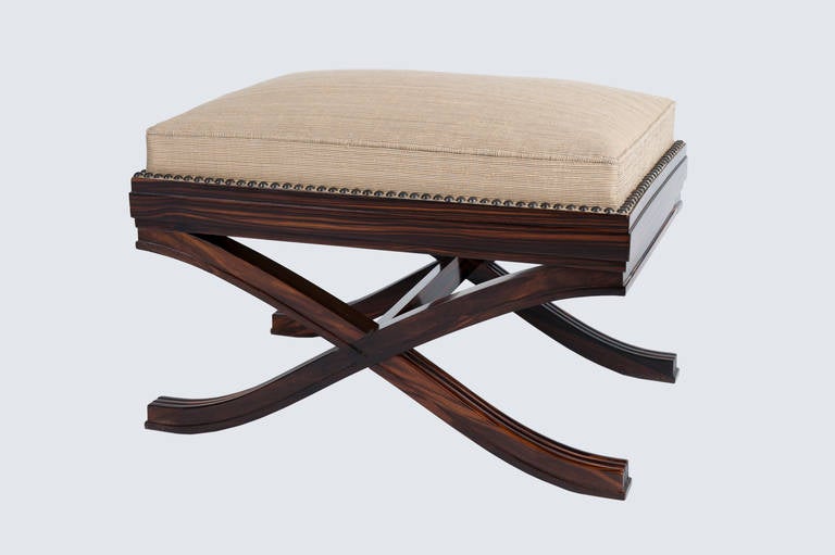 X-shaped stool in solid Macassar ebony.