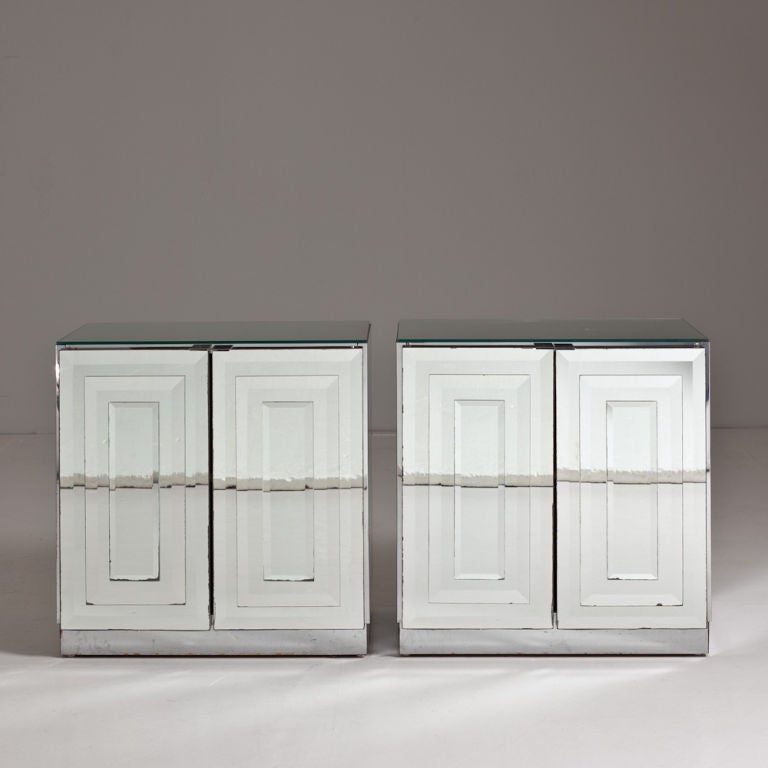 Pair of mirrored side cabinets with deco style layered glass doors and white sprayed interiors.

Please note the photography shows reflection of the floor/walls hence the line.