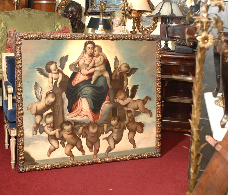 Beautifully painted large oil on canvas of the Virgin Mary and Baby Jesus in carved and giltwood frame, Latin America, late 18th-early 19th century. Painting has had recent restoration and cleaning.