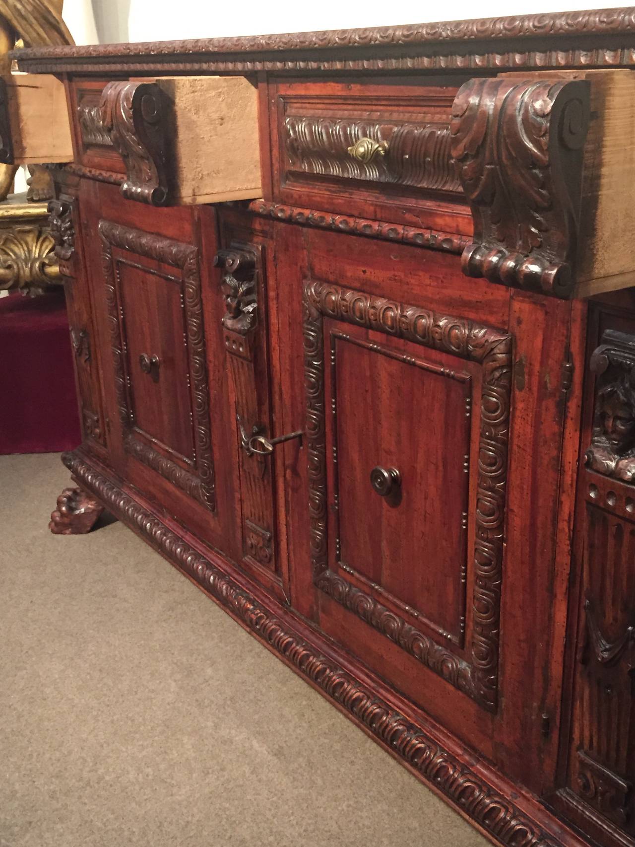 Beautiful 1600s credenza, very particular. Very very incredible wood work, two doors, two drawers plus three small hidden drawers.