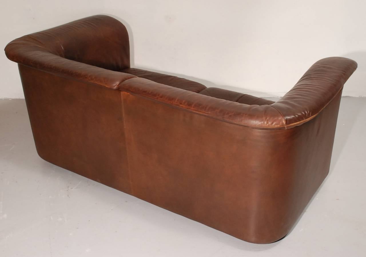 One of Two Leather Two-Seat 