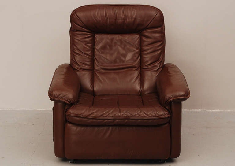 Nice club chair from De Sede Switzerland. Made from the best materials, like a solid wooden frame and top quality leather. This couch is more than 40 years old, but still in a very good condition. The matching two seater (see other offers) comes