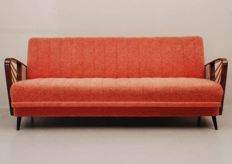Very original French sleeping sofa with the original fabric. The couch can easily be converted into a bed for two persons. Quality of the seats is very good to sit on and for sleeping. All the springs are intact and comfortably working. 
Since the