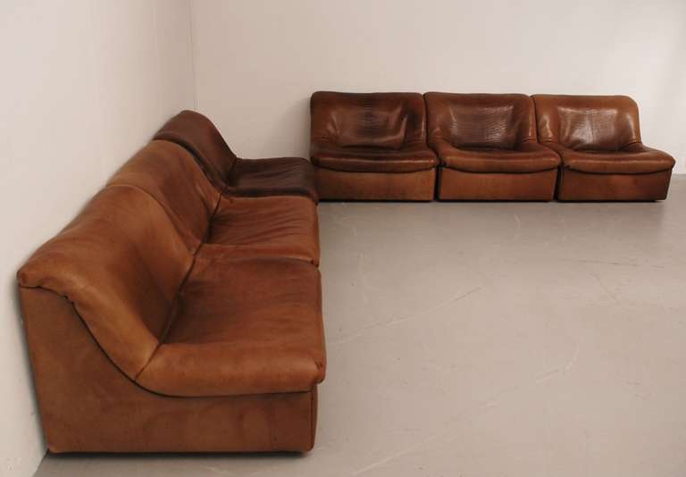Nice 6-pieces of the DS-46, made on a frame of solid wood with the thickest leather of the Sede collection. The different seats have different patin. Some are lighter, some are more dark, depending on the place they had in their former home. There