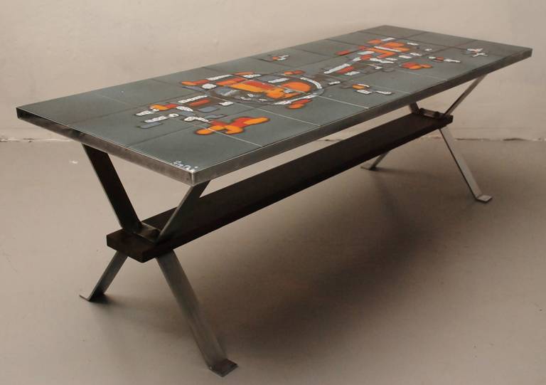 Original and beautiful Belgian tile coffee table from Adri. The painting in the style of Karel Appel is divide over 24 tiles and undamaged. The chrome frame is connected with a palisander plank