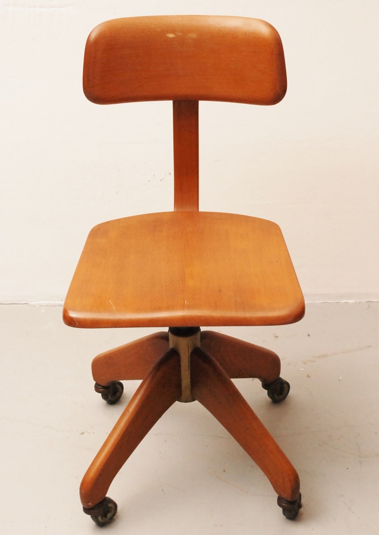 Very rare industrial, solid beech chair. With adjustable seat and rubber wheels. The chair is working and complete.