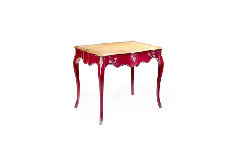 The Aquitaine desk is shown in Cherry wood with a Prune finish and top in Leblon. It has rounded, elegantly shaped legs, magnificent handles and stunning decorative ironwork along the legs. Note the delicate finish and the refined hand carvings on